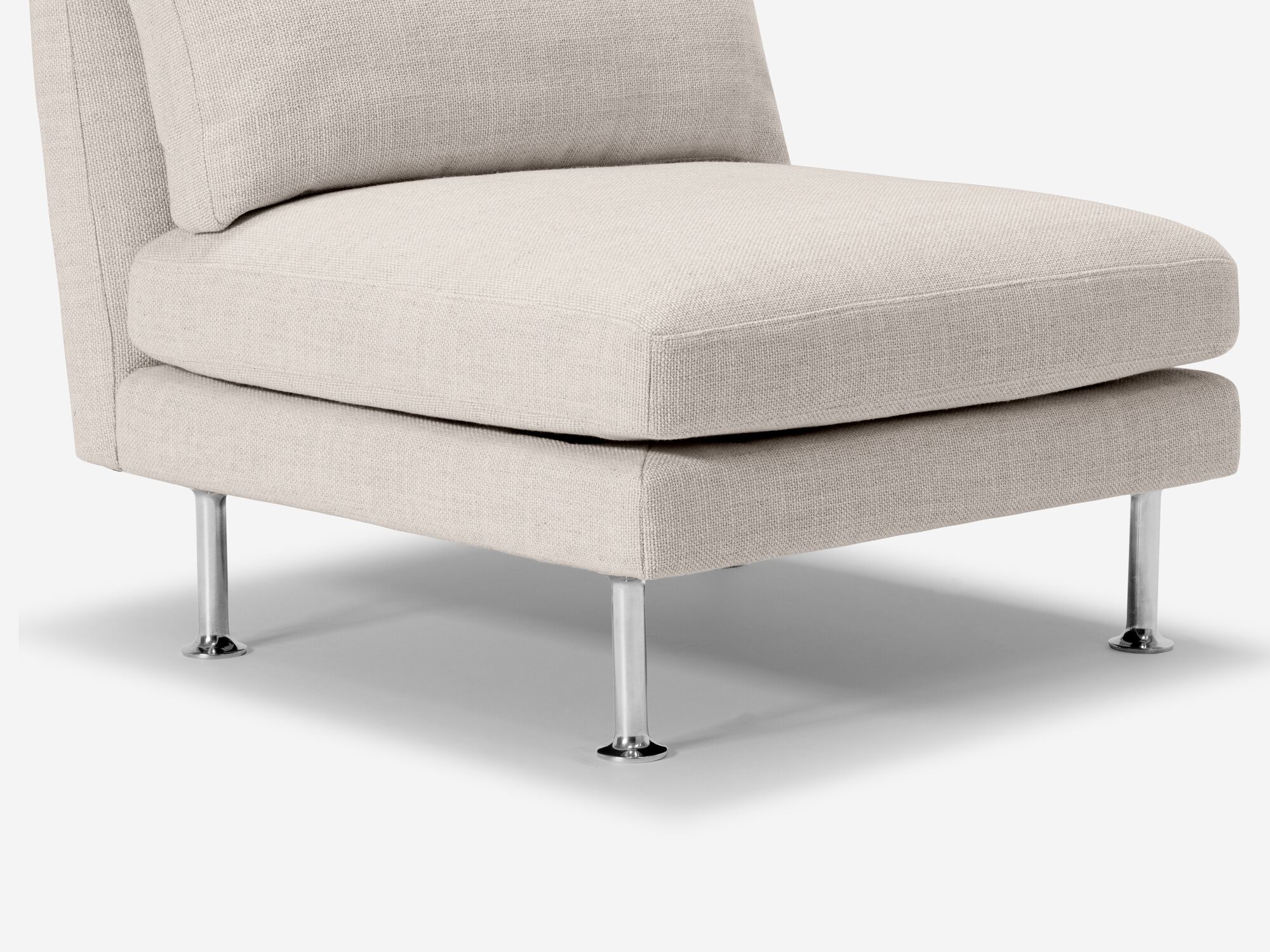Leg detail view of ivory armless chair